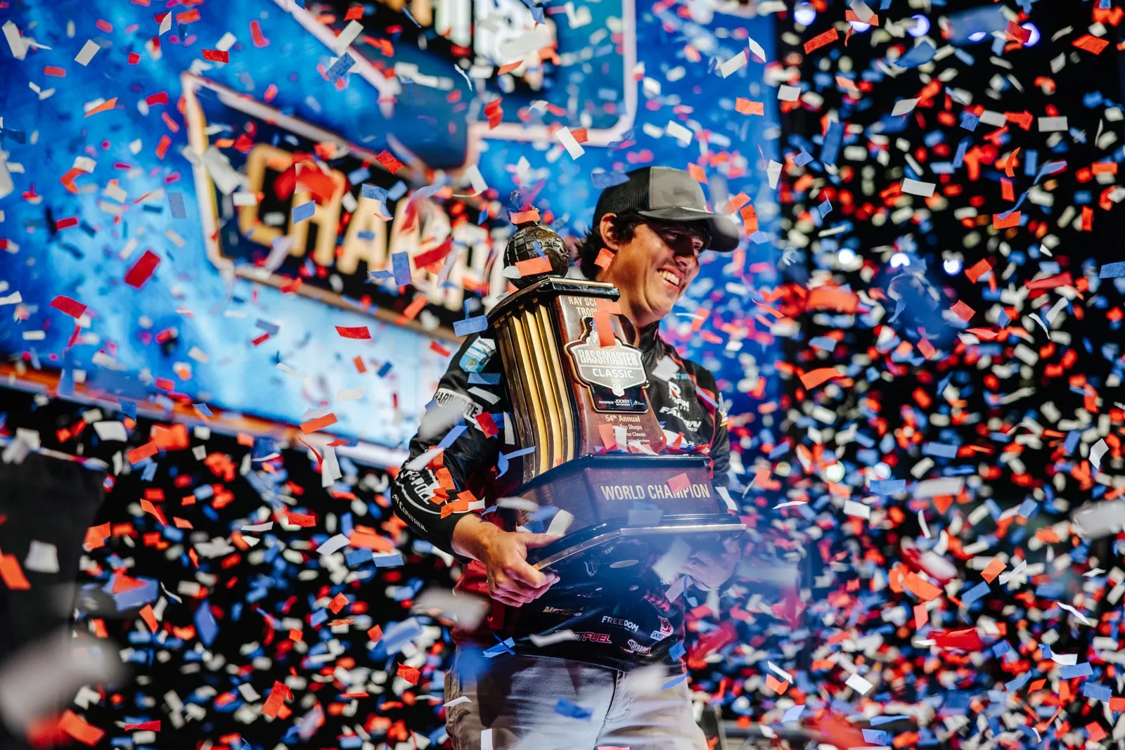 Justin Hamner at the 54th annual Bassmaster Classic, holding the World Champion trophy.