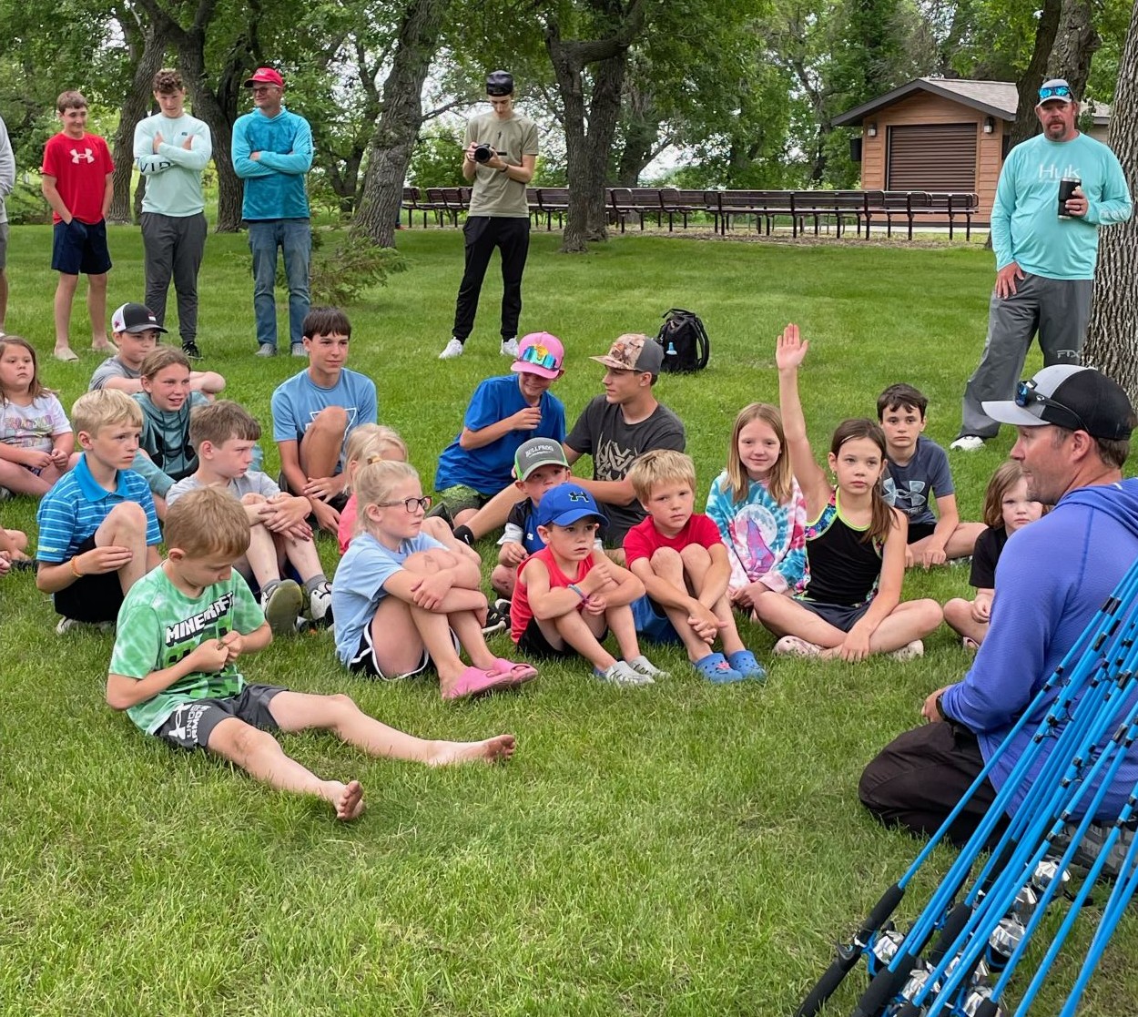 Spencer Deutz educating the youth at the 48th Annual Devils Lake Chamber of Commerce Fishing Tournament.