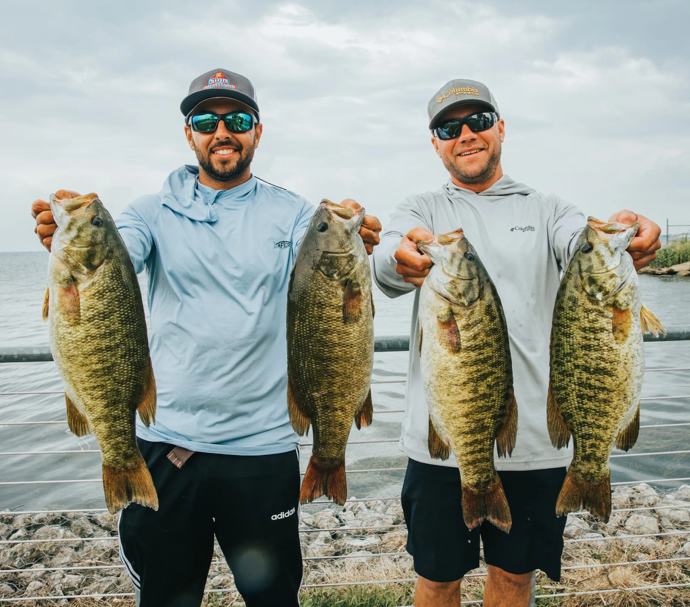 men holding fish